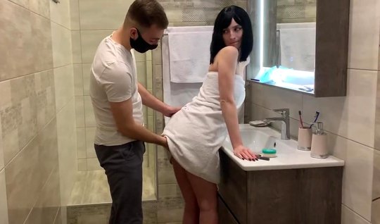 Russian brunette standing fucks in pussy with a guy in the bathroom 