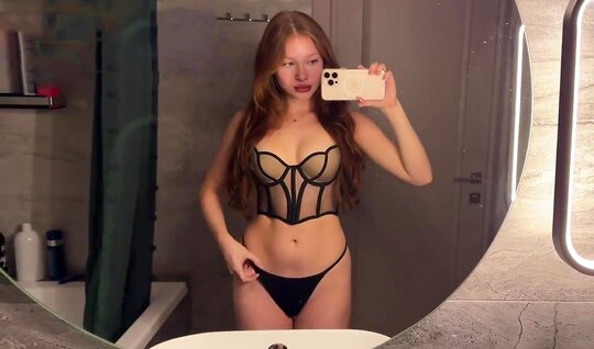⁣Sexy red-haired girl has fun in the bathroom with a dick 