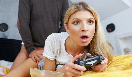 Russian gamer fucks doggystyle with her lover without looking up from the game 